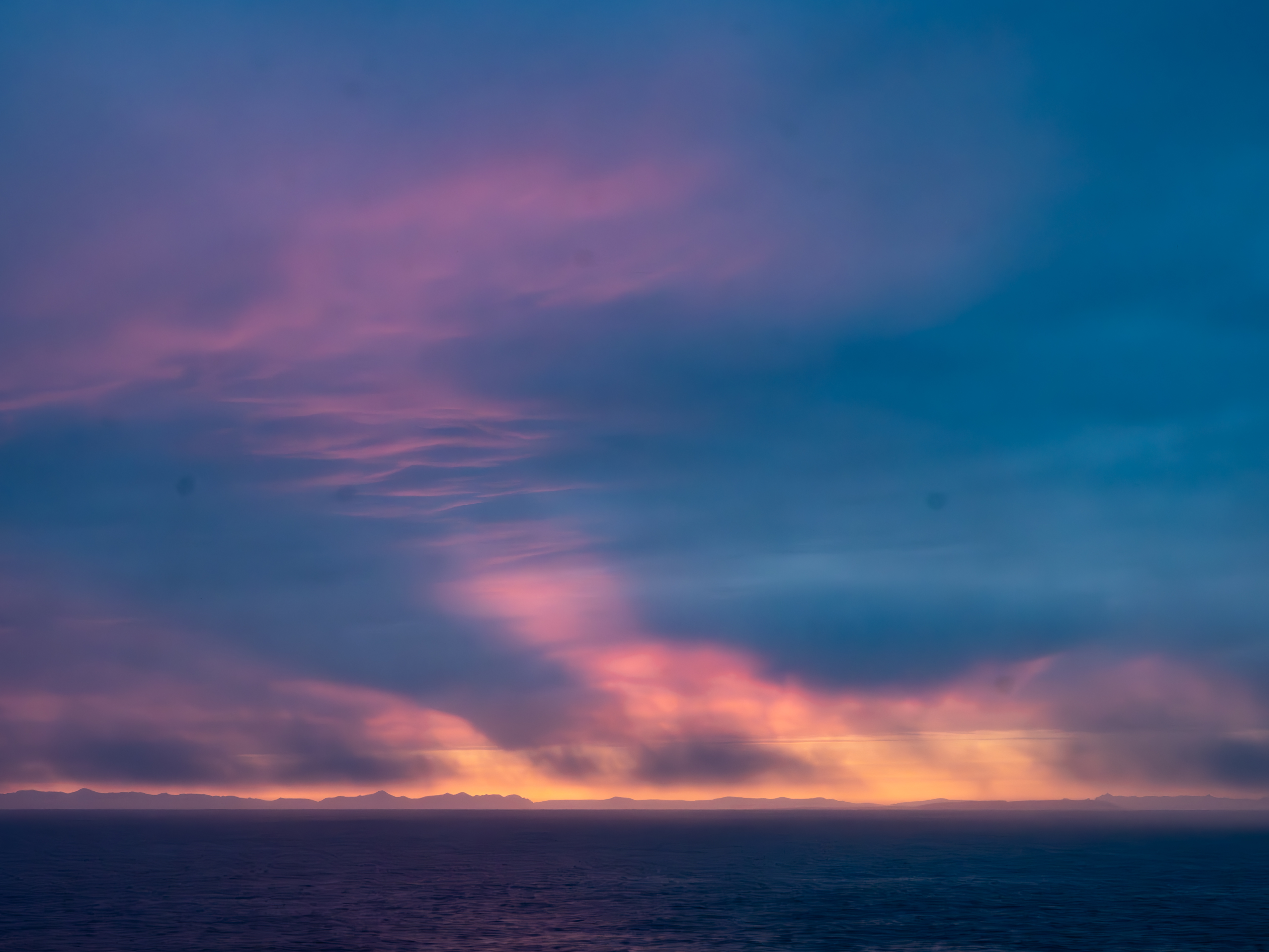 Fire-lit clouds over the Southern Ocean at dusk